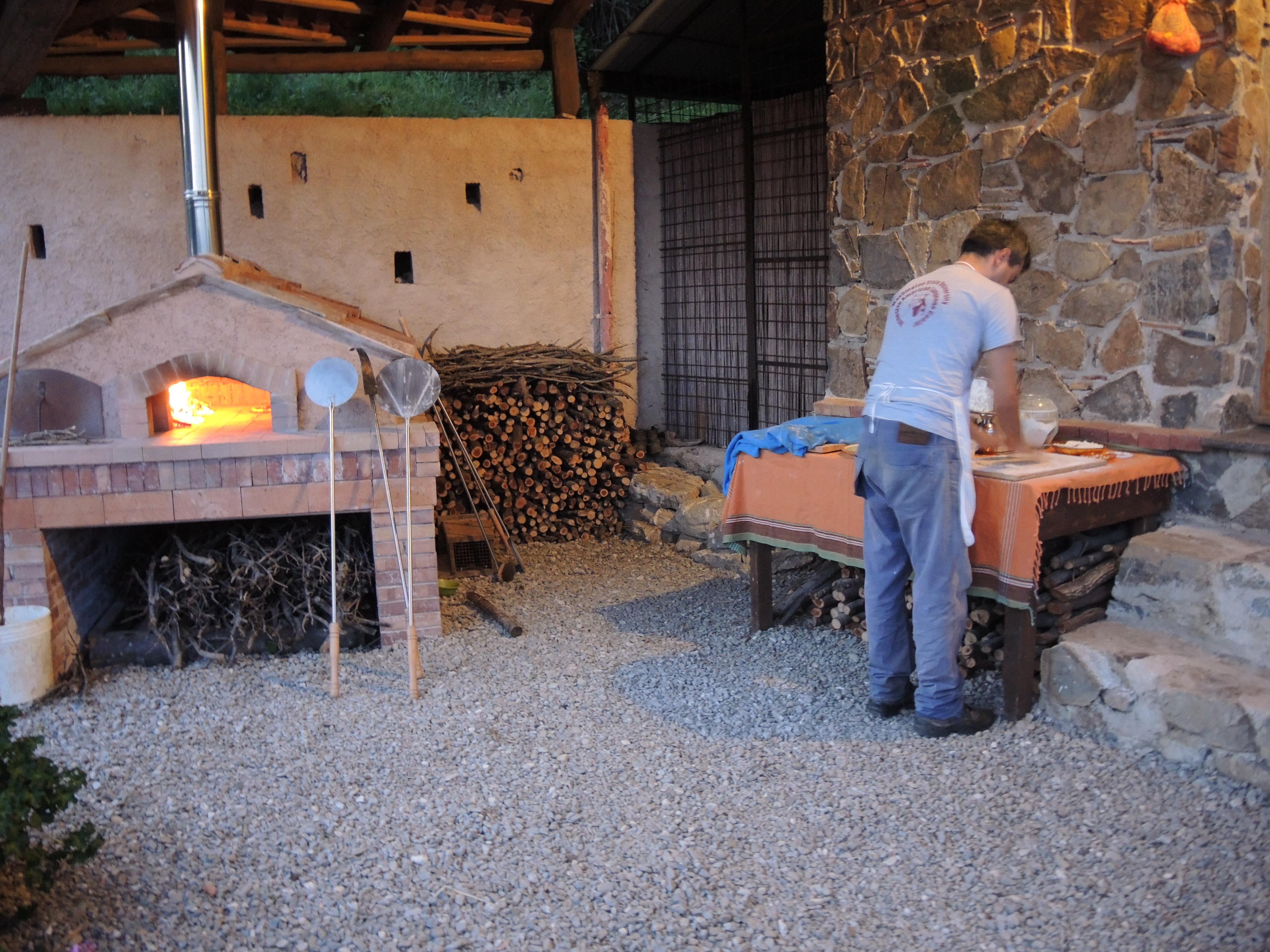 PREPARING PIZZA IN THE TRADITIONAL OVEN